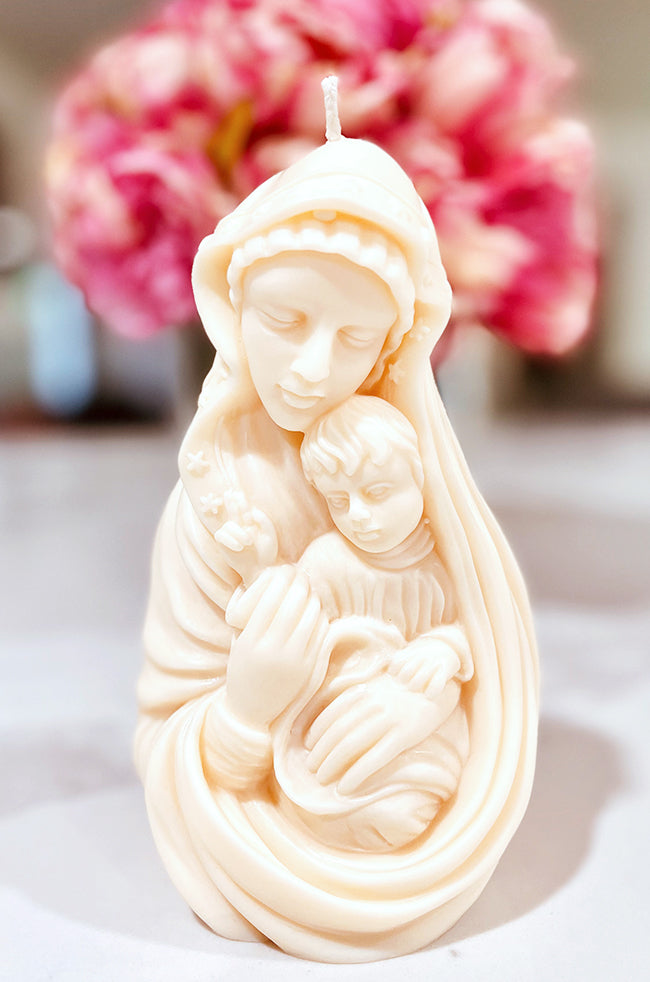 Madonna's Love Candle: Madonna’s Love candle hand-poured in creamy soy wax, depicting a symbolic embrace between mother and child.