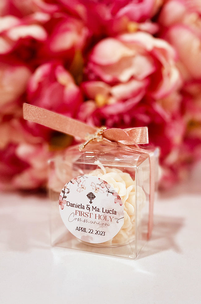 Mini Bloom Gifted Candle: Single Mini Bloom candle favor with gold cross charm and pink bow.