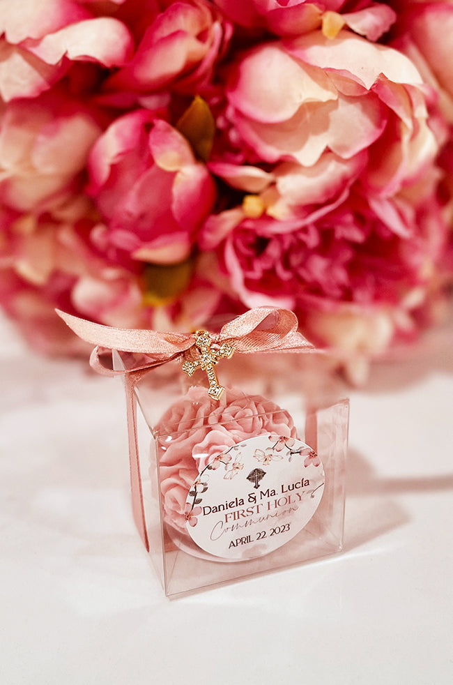 Mini Bloom Gifted Candle: Single Mini Bloom candle favor with gold cross charm and pink bow.