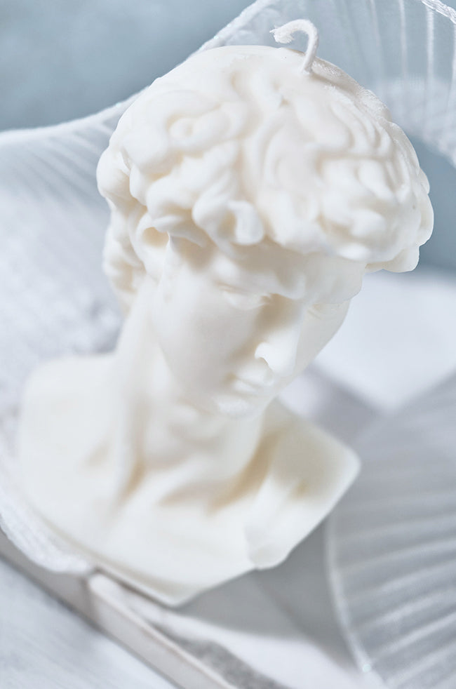 The Light of David Candle: Angled close-up of The Light of David sculptural candle highlighting the detailed hair, face, and bust design.