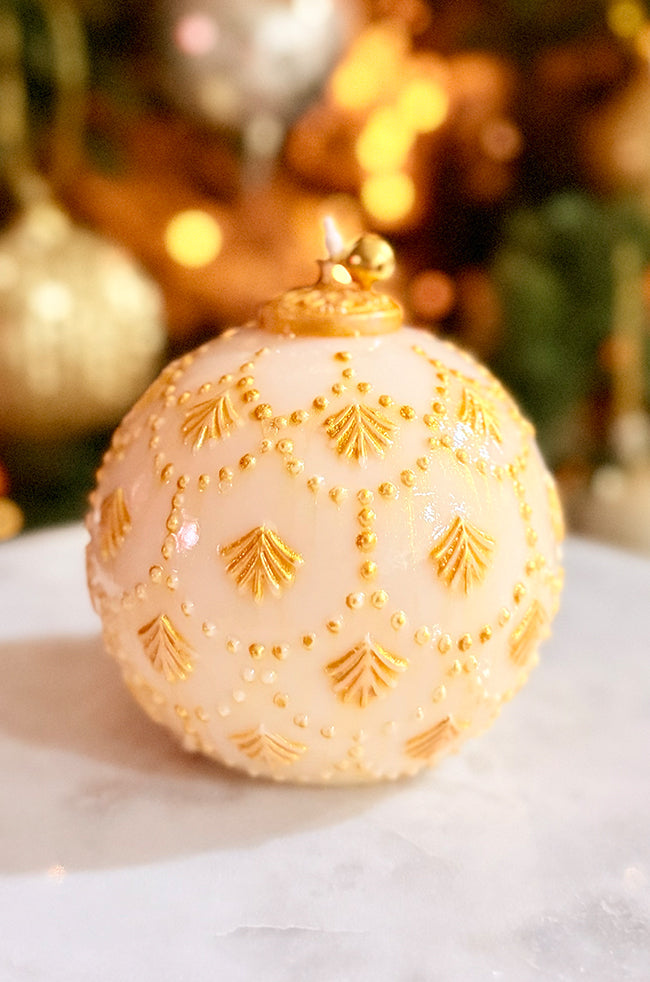 Golden Star Ornament Candle: Minimalist luxury candle shaped like a Christmas ornament, featuring intricate golden design work and glossy sheen, perfect for festive decor styling.