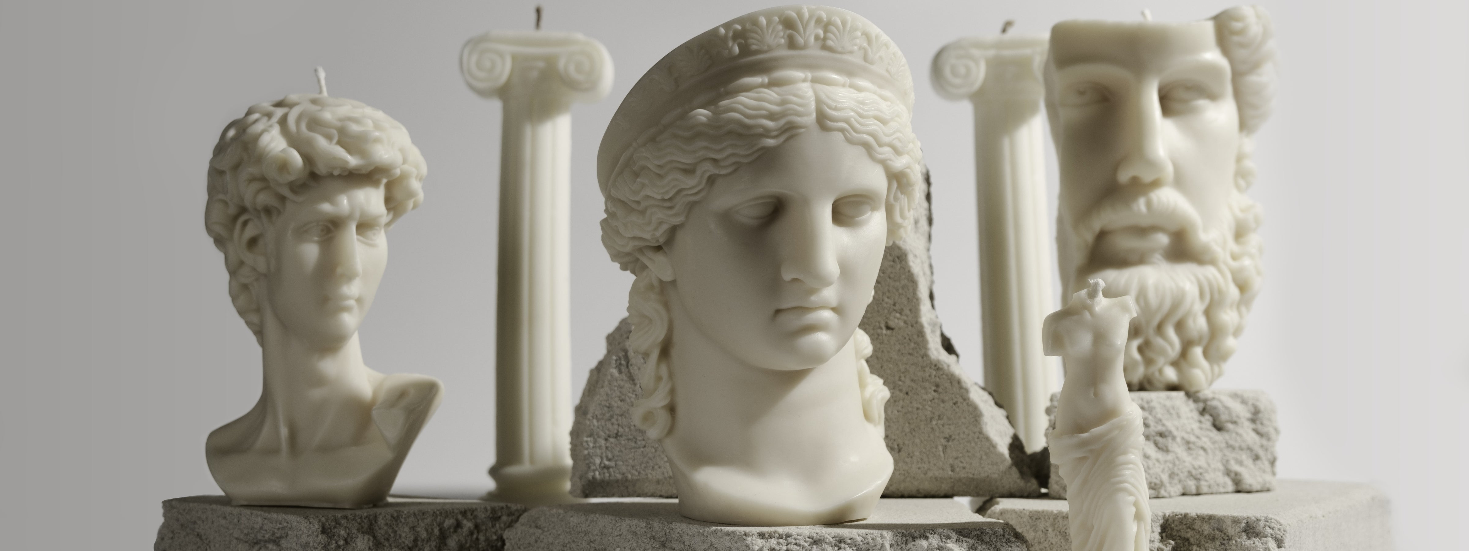 Dahil Bar luxury sculptural candles featuring classical busts and columns styled as an elegant statement display for luxury gifting.