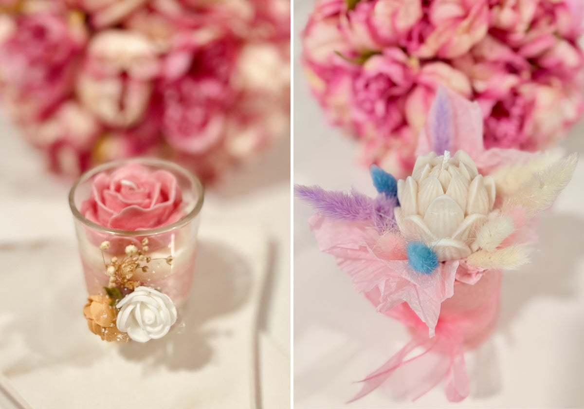 A split-view close-up of a decorative floral arrangement in a small clear glass cup on the left and a matching floral wristlet or accessory on the right, both featuring pink and white flowers with soft pink ribbon and delicate feathers against a blurred pink floral background.