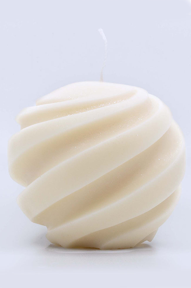 Fiery Swirl Candle: Sculpted ivory soy candle with a round shape and elegant swirling grooves, resembling a twisted meringue or soft spiral.