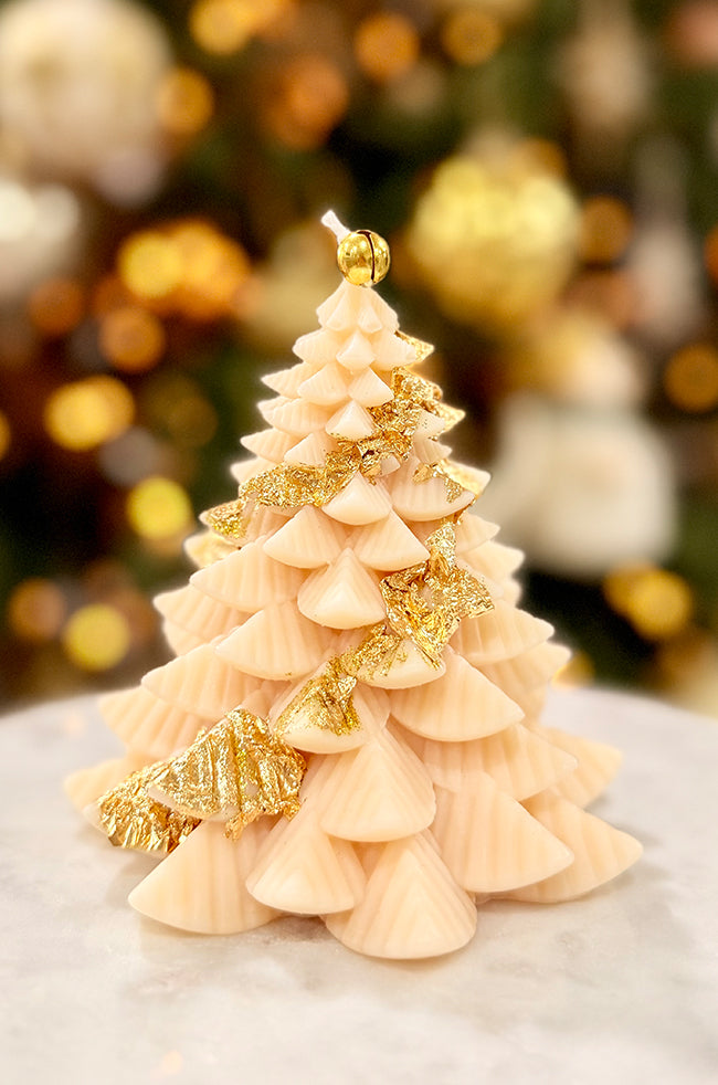 Fiery Tree Large Candle: Luxury large Christmas tree–shaped candle with tiered ivory branches, hand-applied gold leaf accents, and a gold bell topper.