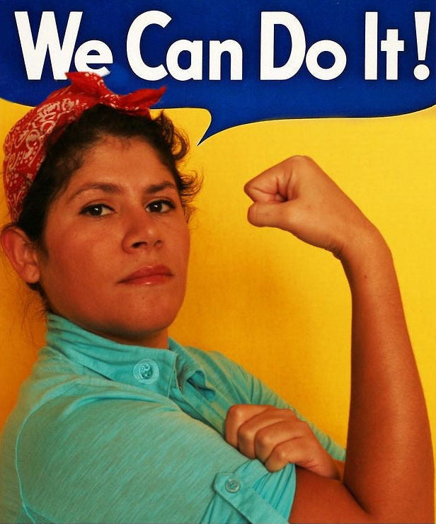 Hilda Rodriguez posing in a Rosie the Riveter–inspired “We Can Do It!” portrait, wearing a red bandana and flexing her arm against a blue and yellow background.