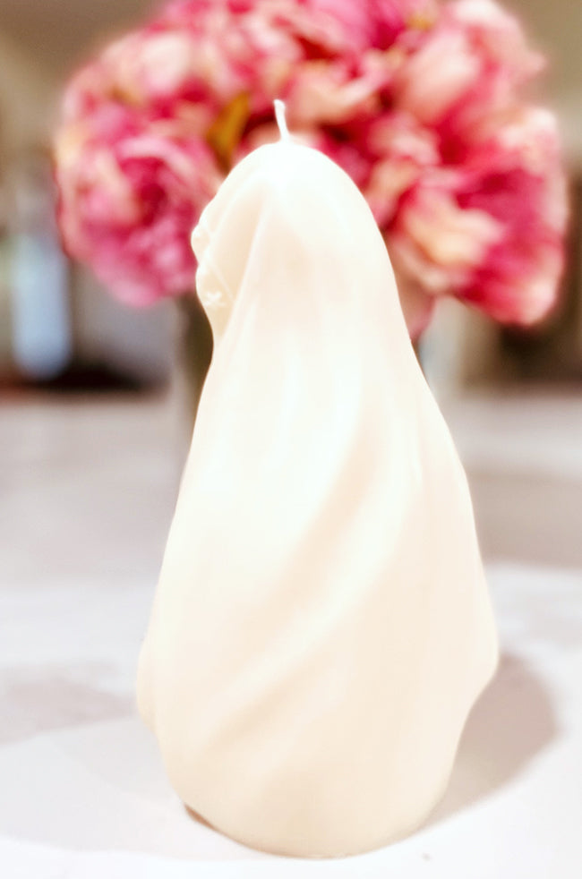 Madonna's Love Candle: Side view of the sculpted Madonna’s Love candle revealing delicate details of the draped veil and soft curves.