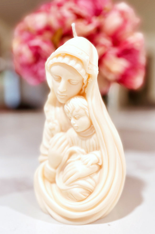 Madonna's Love Candle: Detailed handmade candle of a mother and child sculpture, evoking purity and grace in minimalist home décor.