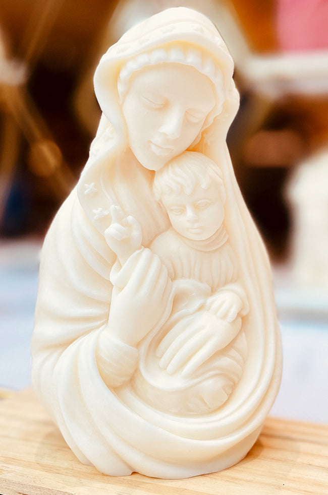 Madonna's Love Candle: Handcrafted sculpted candle inspired by the Madonna and Child painting, depicting a mother tenderly holding her child — a minimalist luxury décor piece symbolizing eternal love and serenity.