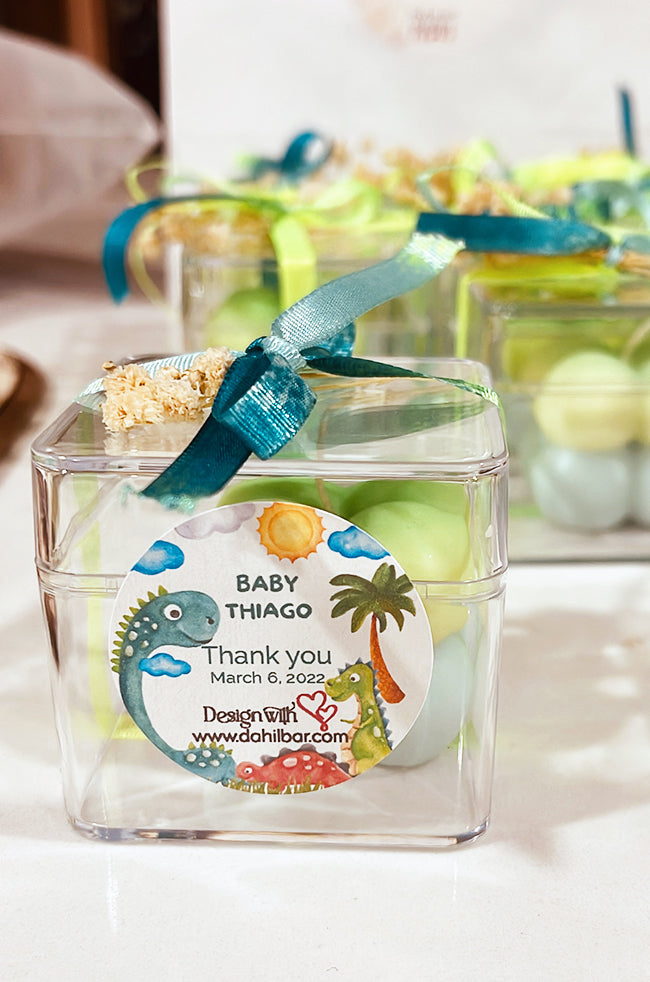 Mini Bubble Candle: Green and blue Mini Bubble candle favor box with dinosaur baby shower label and teal ribbon.
