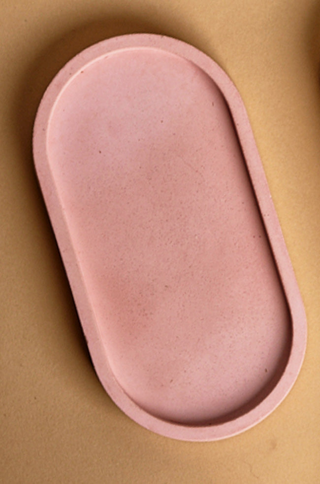 Oval Tray: Blush pink oval tray with a sleek silhouette, ideal for holding candles, jewelry, or décor accents.