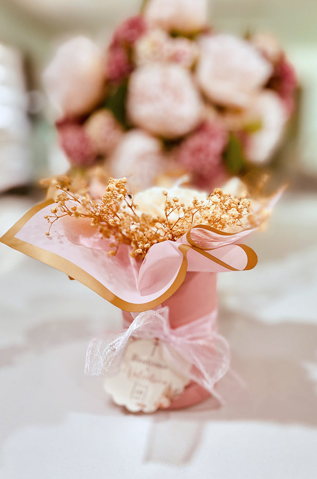 Peony Bliss Bouquet Candle: Back view of Peony Bliss candle bouquet wrapped in blush paper with gold trim and sheer ribbon for luxury gifting.