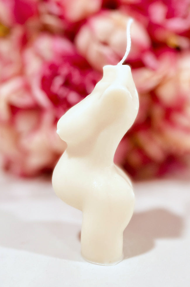 Pregnant Venus Candle: Side profile of the Pregnant Venus pregnancy candle showing the sculpted baby bump.