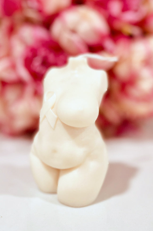 Resilient Warrior Candle: Angled front view of the Resilient Warrior sculptural candle with awareness ribbon detail.