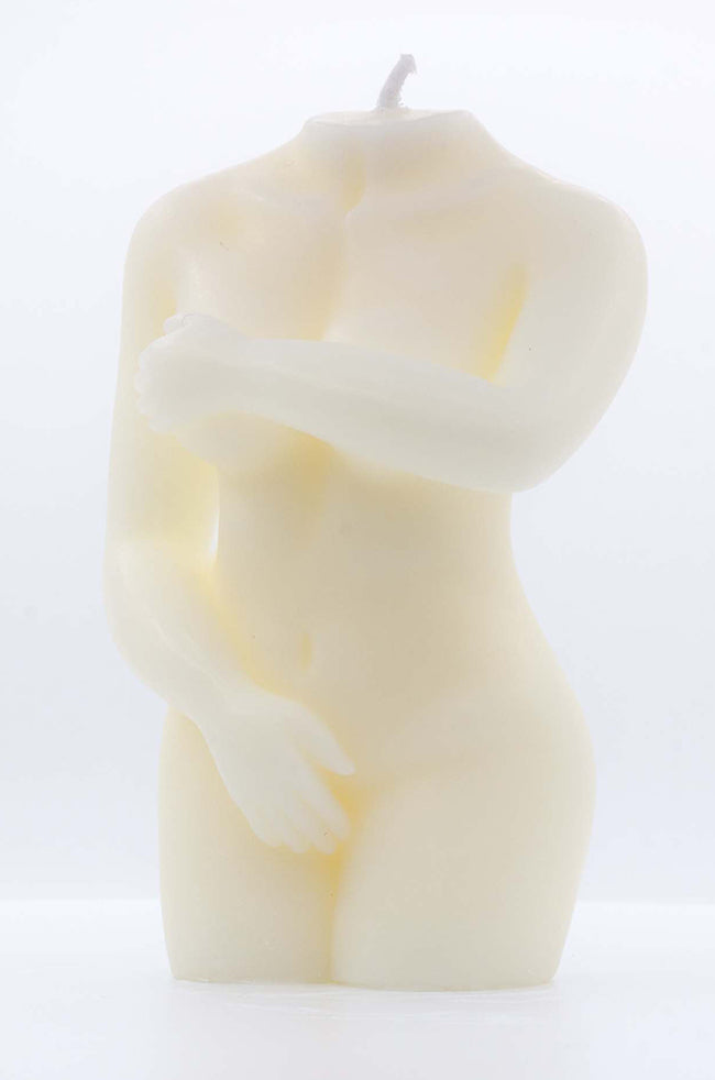 Shy Lady Candle: Front view of the ivory Shy Lady sculptural candle with one arm covering the chest and the other resting across the lower body.