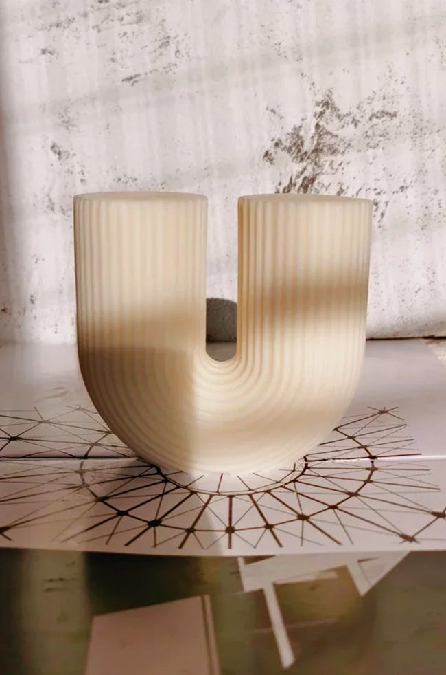 Twin Candle: Modern U-shaped Twin Candle with ribbed texture and dual wicks, handcrafted for minimalist luxury home décor and elegant interior styling.